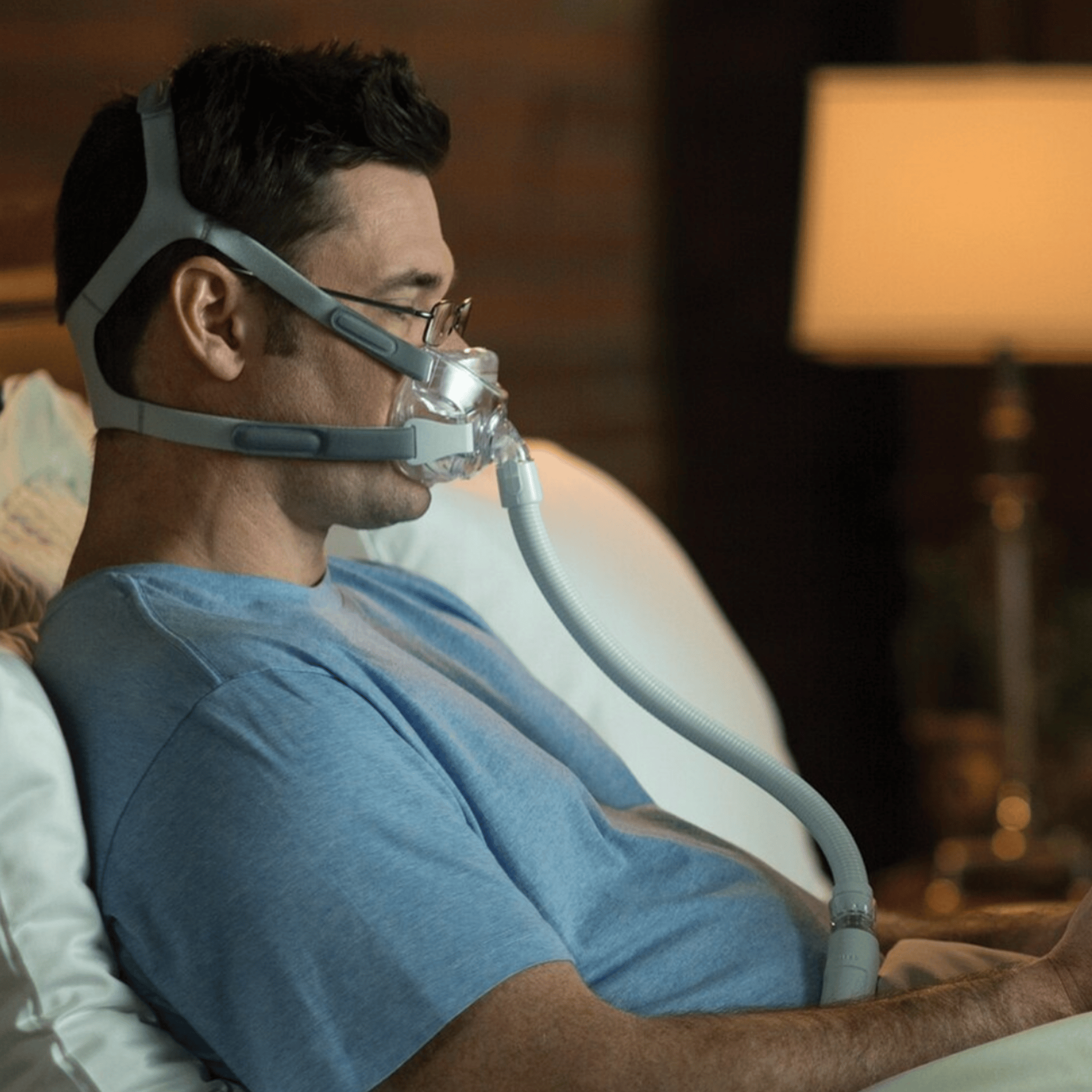 man wearing amara view mask in bed seen from the side