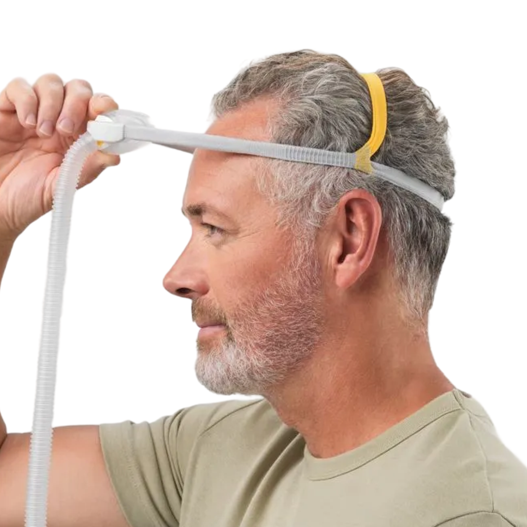 Image showing a man taking of his mask by holding the mask cushion and lifting it up.